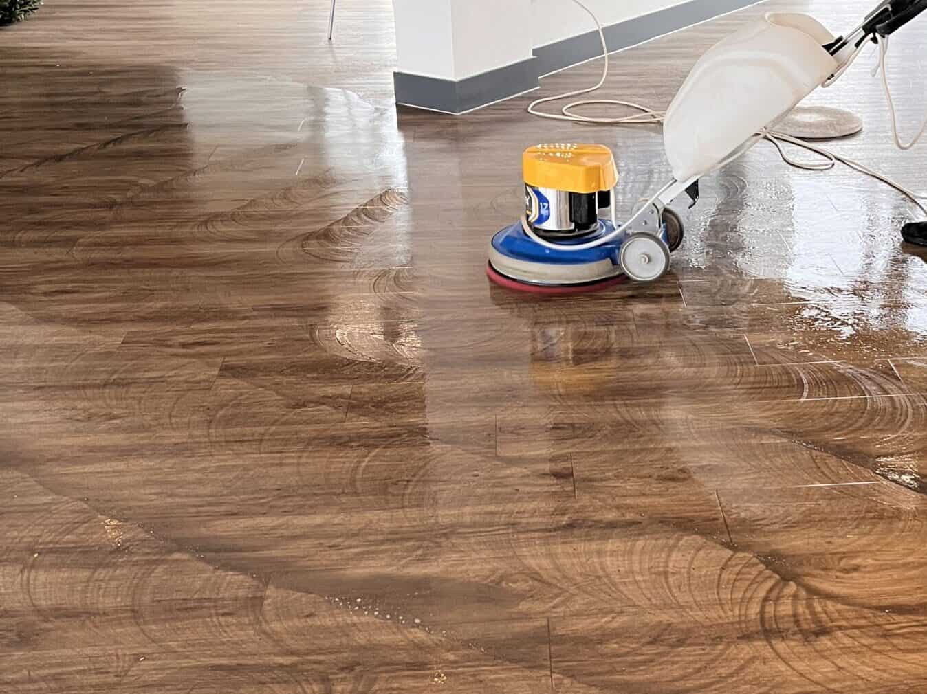 Floor being cleaned with a machine