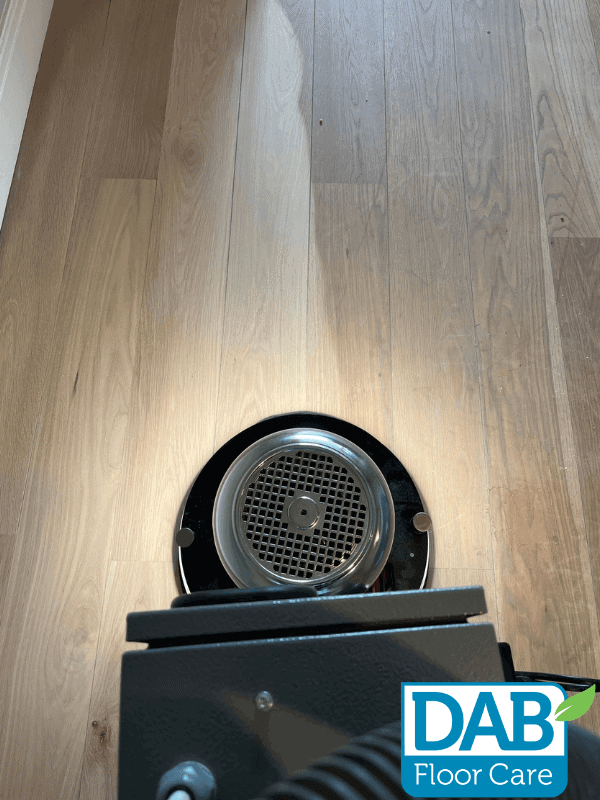 Sanding machine on wooden floor