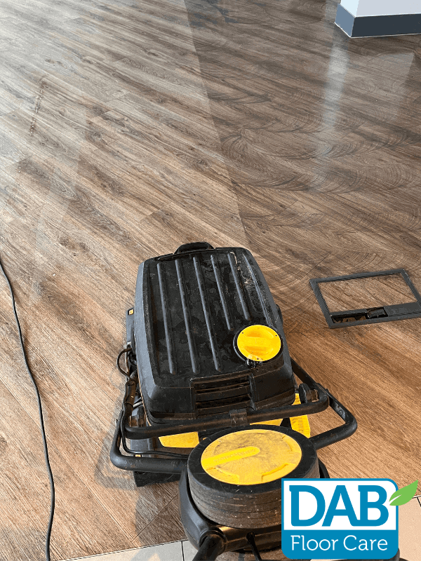 Floor cleaning machine on wooden surface