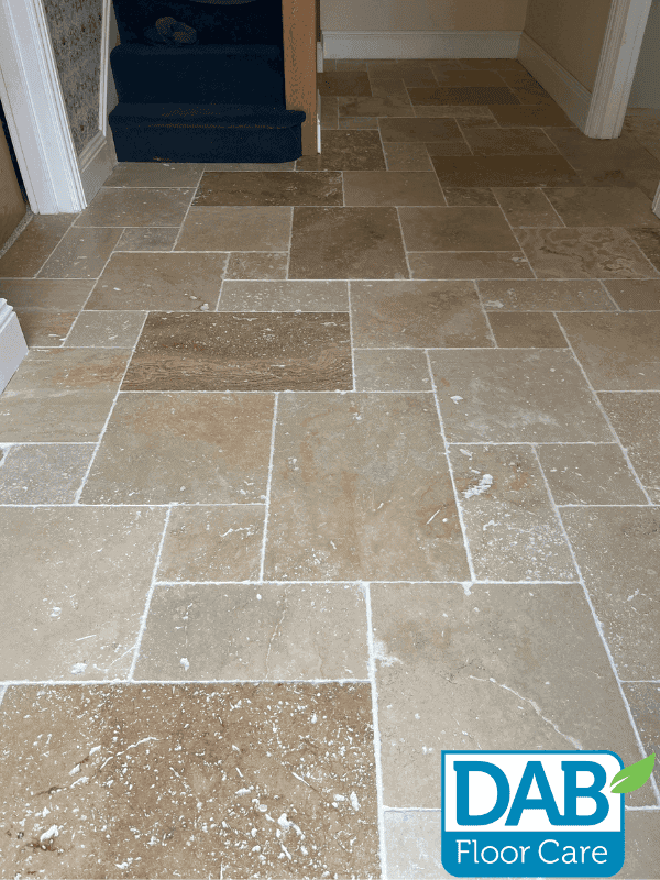 Light-coloured stone floor with patterns.