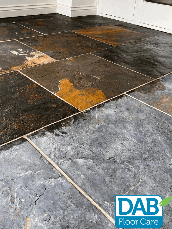Textured slate floor with varied colours.