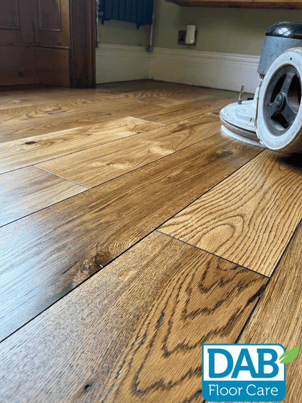 Polished wooden floor with buffing machine.