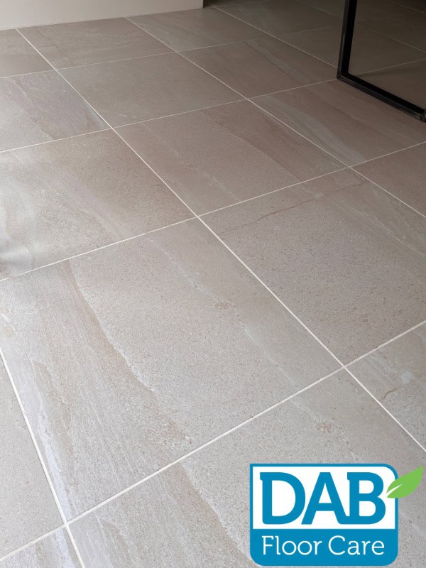 Victorian-style tiled floor after professional cleaning, with brighter grout and a more even finish